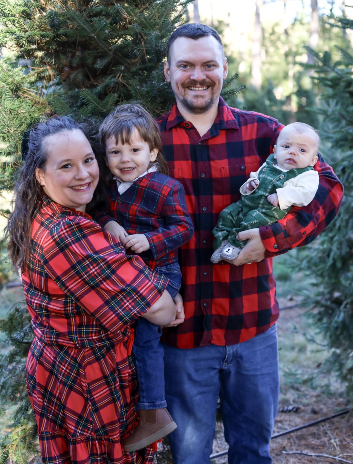 A happy family standing together outdoors